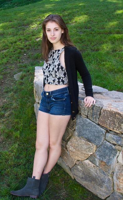 Incorporate summer pieces like crop tops into your fall wardrobe! Claire is wearing a lace, black and white crop top from LF, cardigan from Urban Outfitters, denim shorts from American Eagle, and ankle boots from Buffalo Exchange. 
