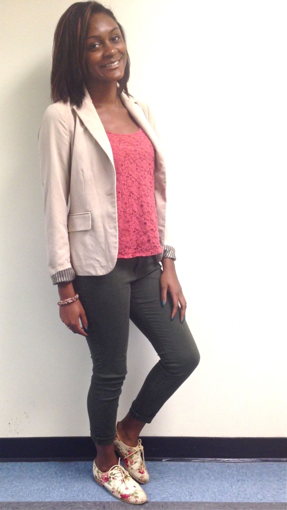 Anyilah is wearing a blazer from Forever 21 that was purchased for $30, a lace tank from American Eagle that was $20, and colored jeans from Old Navy for $20. Bringing together the whole look, her floral oxford flats were purchased from Forever 21 for $15, and her accessories from H&M for $10.