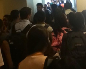 Students flood the new building connecting hallway at passing time.