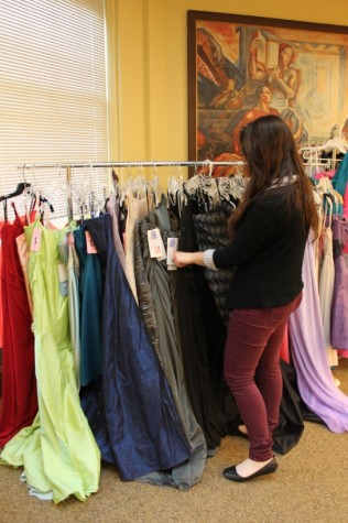 Savannah Viggiano skims the racks looking for a dress for Zoe Uskowski.