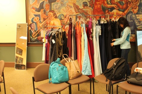 An SHS student checks out senior prom dresses, looking for the perfect color and size.