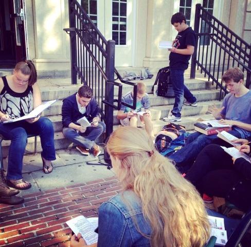Performers read through the script on the first day on rehearsal. 