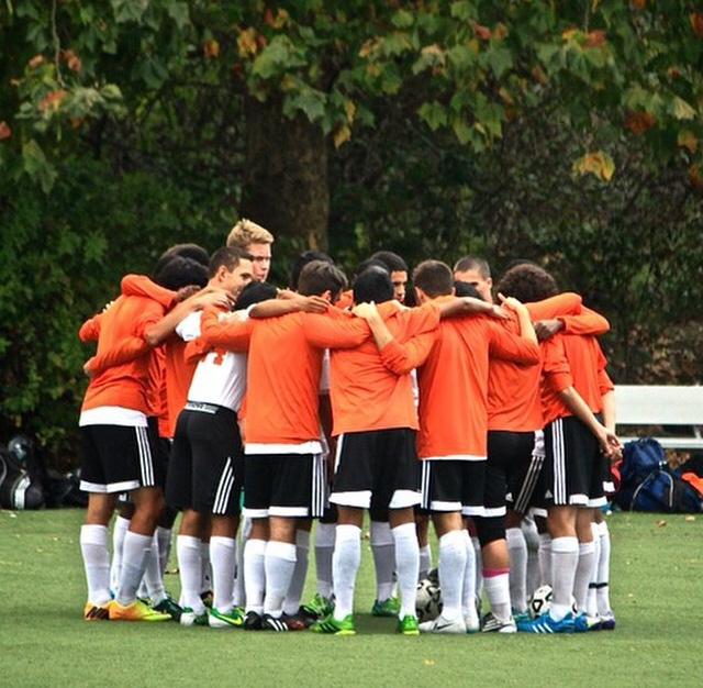 Boys Soccer Team huddle prior to the game.