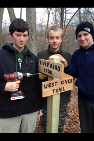Senior Chris Ryan invited friends to help him establish new trail signs along a trail.