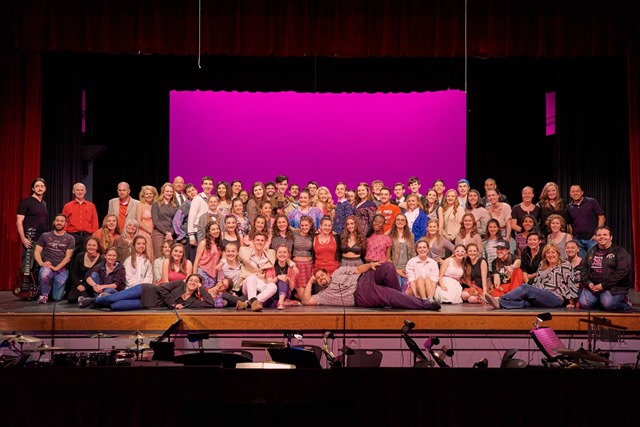 The cast and crew of legally blonde poses for a full ensemble photo. 