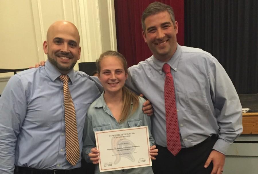 Jenn Krupa, Junior, poses with Mr. Escobar (left) and Mr. Forker (right) after receiving her Dream award
