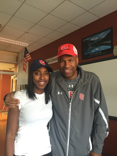 Tiana England (left), who commits to St. John's, accompanied by Red Storm assistant coach Jonath Nicholas (right).