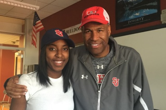 Tiana England (left), who commits to St. Johns, accompanied by Red Storm assistant coach Jonath Nicholas (right).