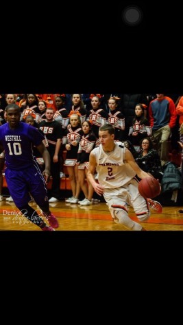 Devito (2) drives past Westhill's Tyrell Alexander (10)