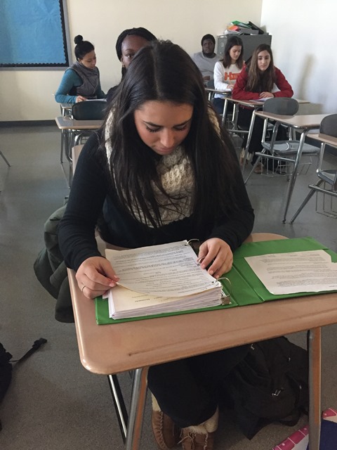 In this staged photo, junior Maddie Santora reviews her notes for AP Language