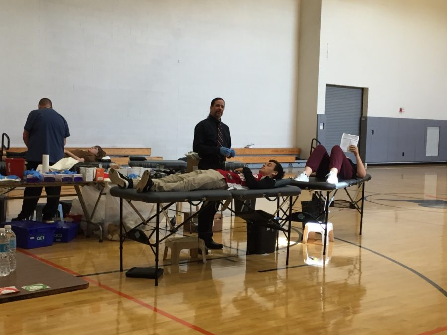 Senior Tazio Torregiani giving blood at SHS on Thursday afternoon