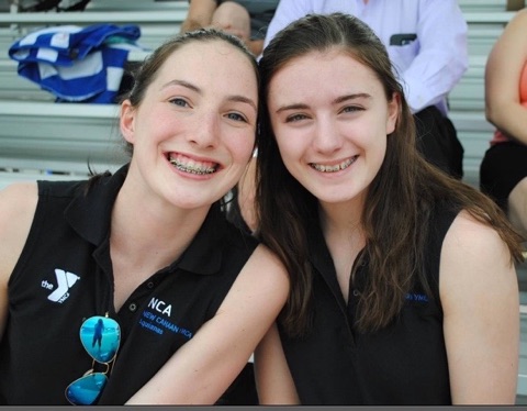 Katherine Reiter (right) poses with a teammate from her synchronized swimming team.  