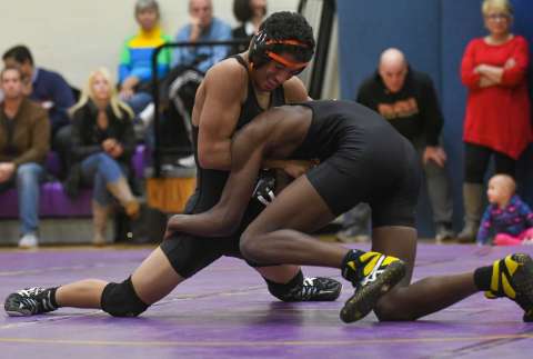 SHS wrestler Julius Page takes down his opponent/