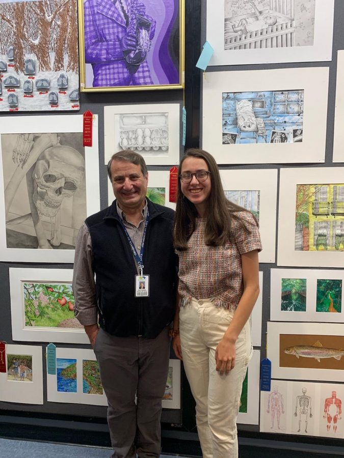 Mr. Cusano with student, Ivy Zingone infront of artwork.