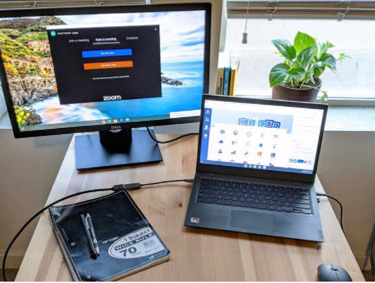 Two Screens for Teachers is an organization that awards teachers with an extra computer monitor to be used during remote learning. A sample teacher setup is pictured here.